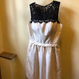 Short ivory dress with pockets.